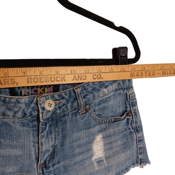 SOMETHING TRICKIE FREE THE REVOLUTION Light Wash Distressed Mini Raw Hem Shorts - Picture 4 of 5